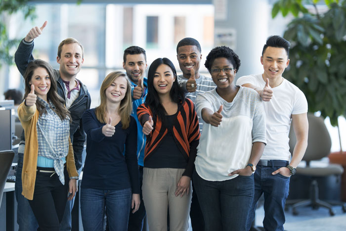 Group of students giving a ‘thumbs up’ to the camera. Group of students giving a 'thumbs up' to the camera.