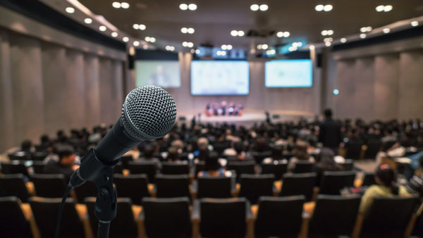 Microphone in front of a conference hall.